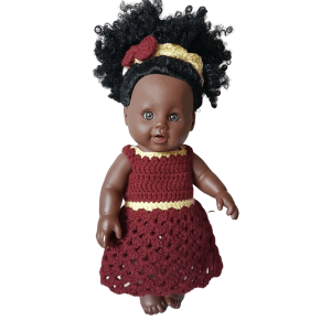 Afro baby doll in a knitted lower nest